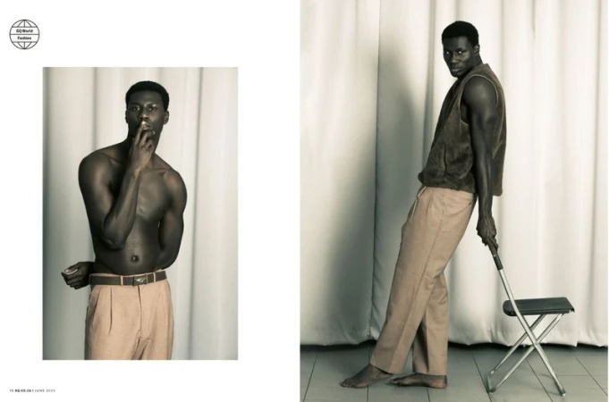 A dark-skinned man poses in a sepia-toned fashion editorial wearing trousers; another man wears a vest and leans against a metal chair.