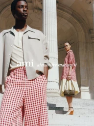 Models posing on grand stone steps outdoors in AMI SS25 Summer Capsule fashion campaign photographed by Crista Leonard.