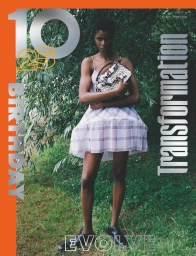 Model standing outdoors holding a patterned handbag in a magazine cover for 10 Magazine 75 Fall/Winter 2025