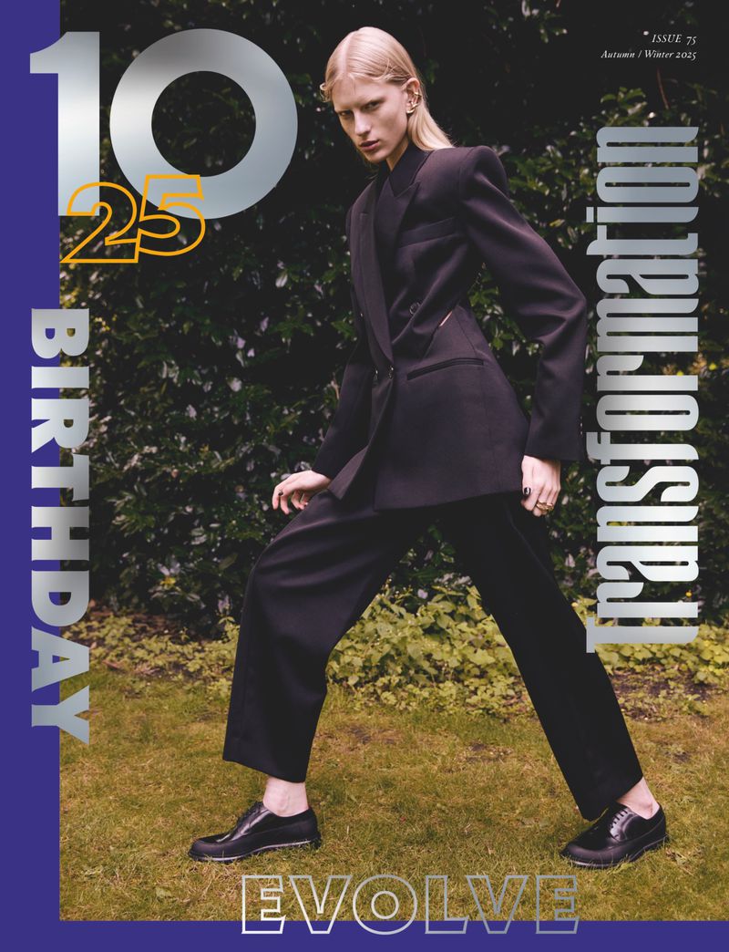 Magazine cover features a blond woman in a dark suit outdoors in front of greenery. Text includes 'Birthday', 'Transformation', and 'Evolve'.