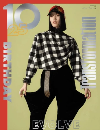Magazine cover with a stylish young woman in a cap, checkered top, and wide pants, set against a vibrant background with bold typography.