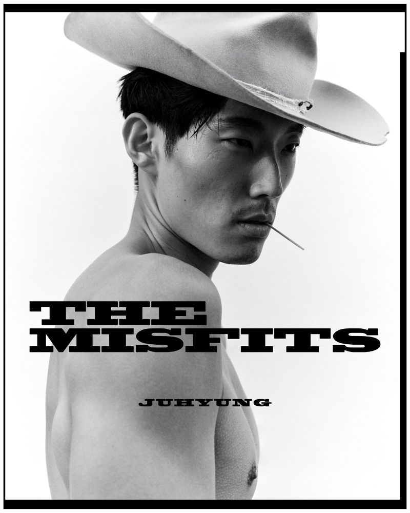 Portrait of a shirtless Asian man in a cowboy hat with a toothpick in his mouth, set against a plain background and black frame.