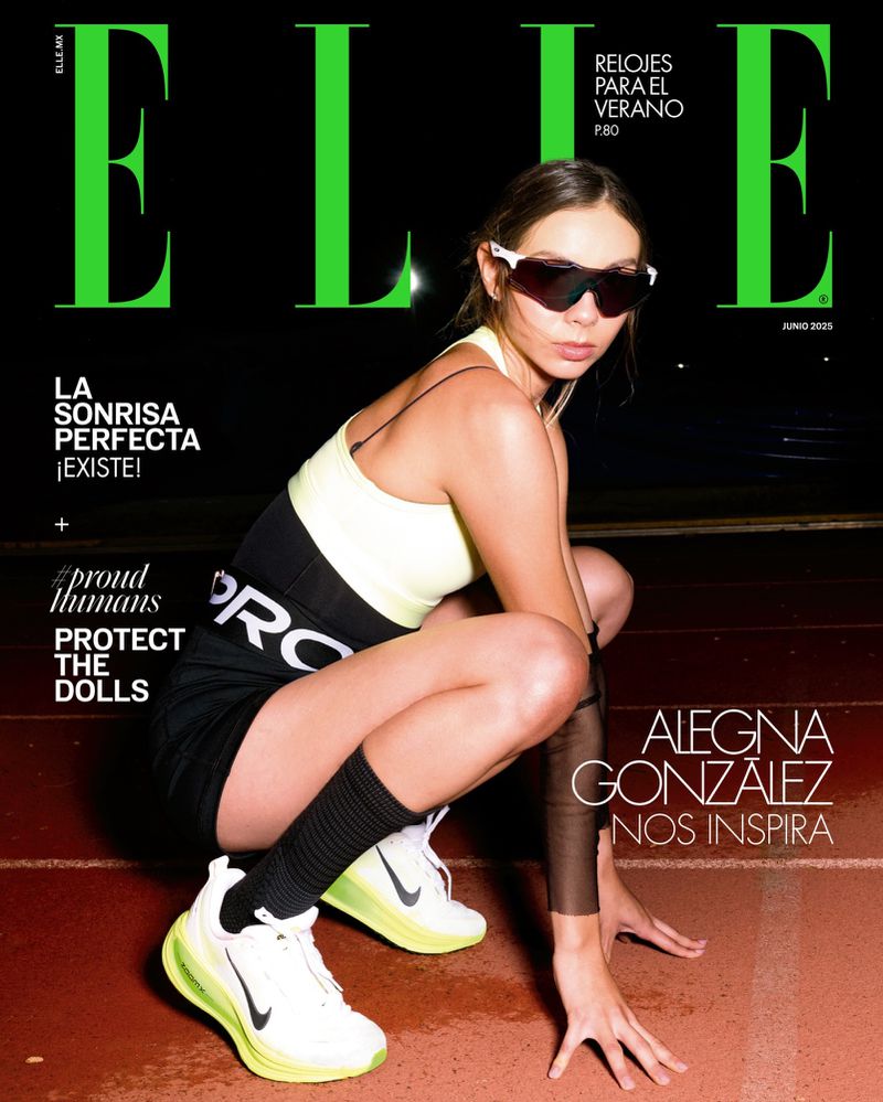 Elle magazine cover featuring a woman in athletic wear crouching on a track, wearing sunglasses and sneakers, with a black background.