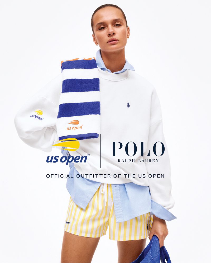 A model wears a white Polo Ralph Lauren sweatshirt with yellow and white striped shorts, promoting the US Open tennis tournament.