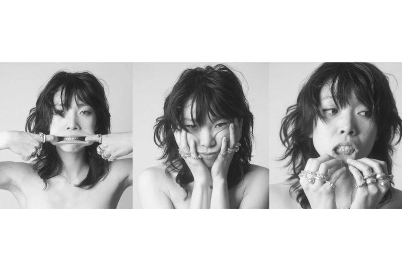 Black-and-white triptych featuring an Asian adult woman with dark, shaggy hair, adorned with rings, posing with expressive facial expressions.