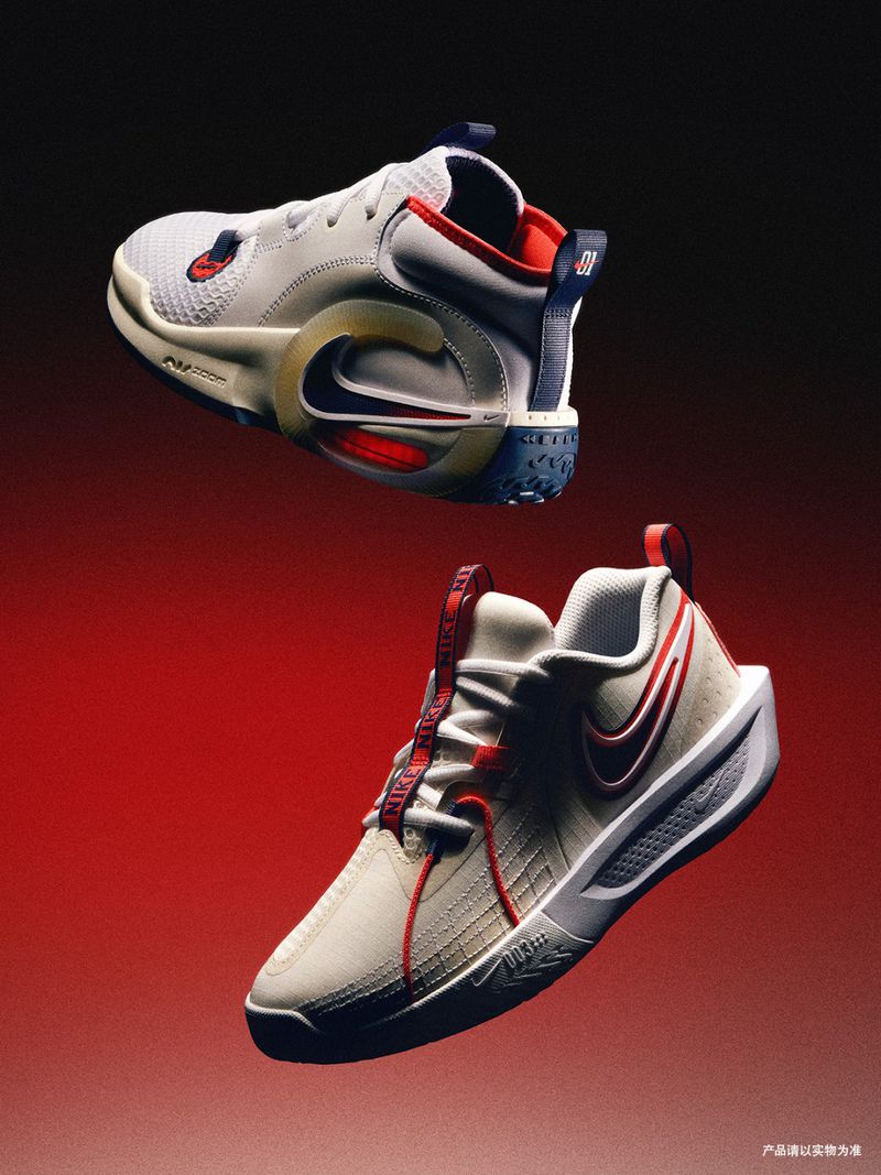 Two white and red Nike athletic shoes are featured against a gradient red to black background in a studio product shot.
