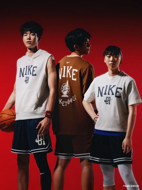 Three athletes showcase Nike apparel, including shirts and shorts, against a vibrant red backdrop in an indoor setting.