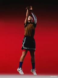 Basketball player jumping and shooting against a vibrant red backdrop for the Nike SU25 CHBL project
