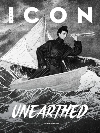 Fashion magazine cover features a man in a boat with a sail, holding a spyglass against a monochrome water and sky background.