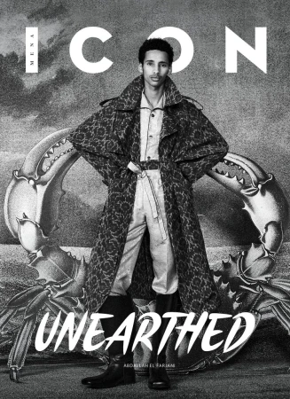Fashion magazine cover featuring a male model in an overcoat, posing against a crab claw graphic with the title 'ICON' in white letters.