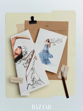 Fashion-themed flat lay featuring model photos, fountain pen, and document folder on a neutral surface, creating a stylish, editorial composition.