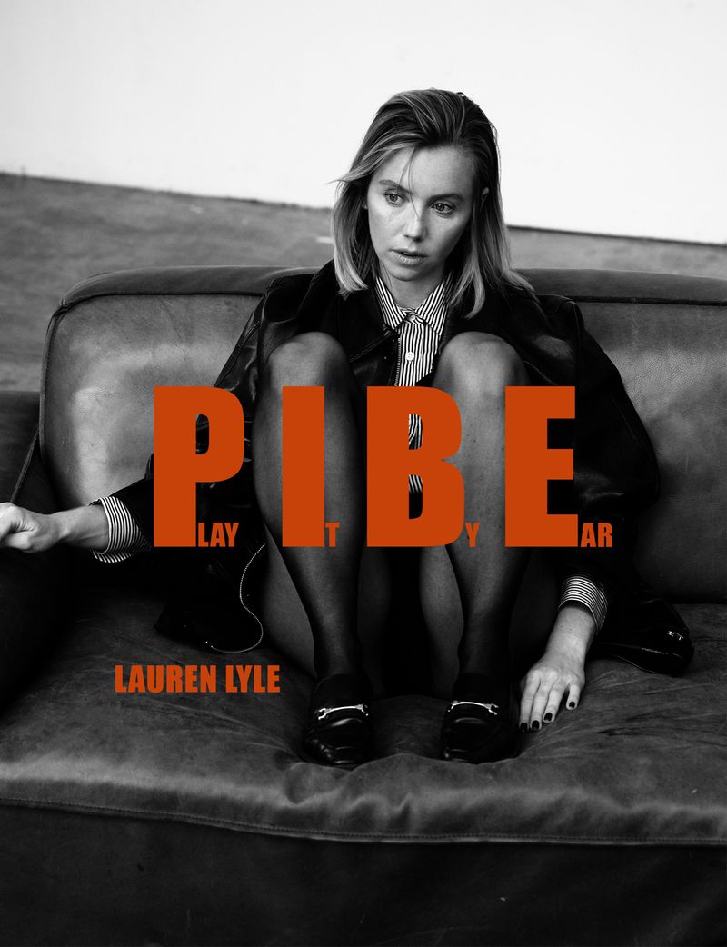 Black and white portrait of a woman in a striped shirt and dark jacket, sitting on a couch, overlaid with bold orange text.