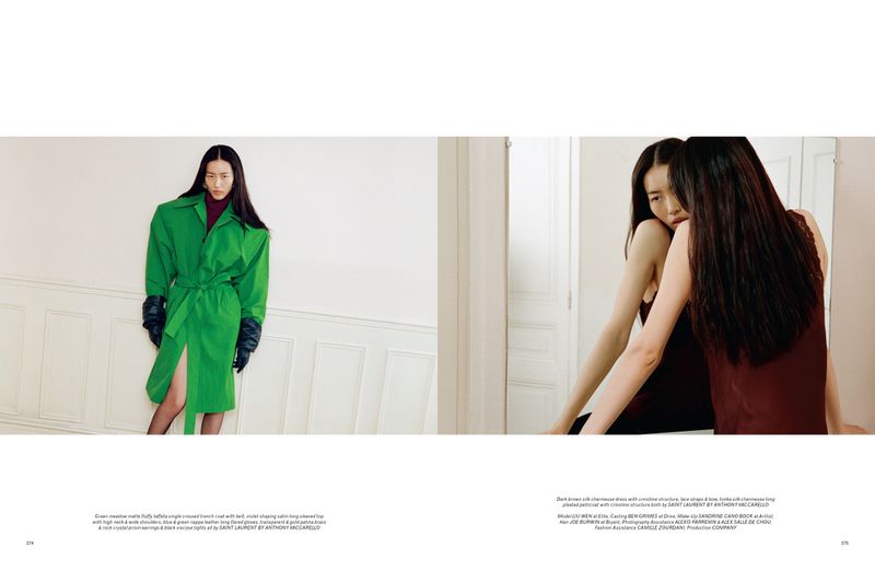 Asian woman in a green trench coat with black gloves in a fashion editorial shot, complemented by a mirror reflecting a similar scene.