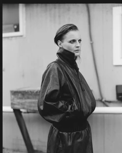Model Guinevere van Seenus wearing a dark leather jacket in a black and white portrait for V Magazine Autumn Awakening.