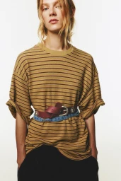 Model wearing striped t-shirt and burgundy belt against a white background for Pull and Bear