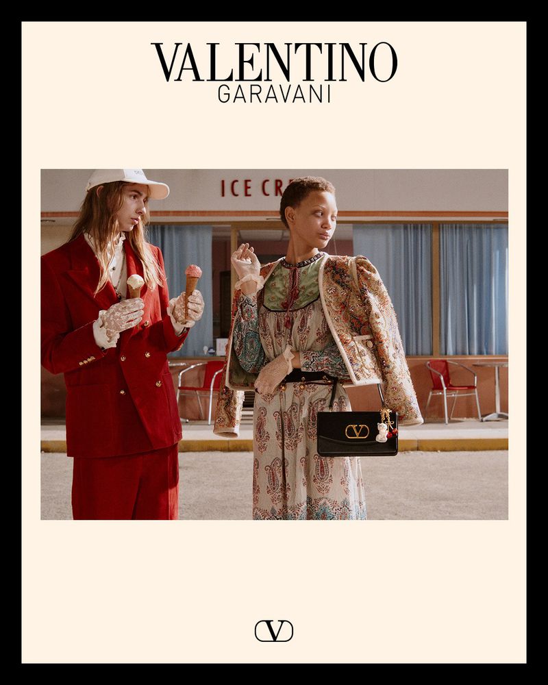 Valentino Garavani fashion ad featuring two models in a vintage-style outdoor setting, one holding an ice cream cone.
