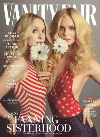 Vanity Fair cover featuring Dakota and Elle Fanning, with a close-up of the actresses holding daisies, wearing red, white, and blue outfits.