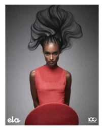 Black woman with elaborate sculpted braids wearing an orange top against a grey seamless background for O Globo Cabelos Livres