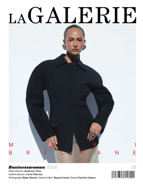 Magazine cover featuring a woman in a black jacket and large gold earrings, against a light background. La Galerie logo.