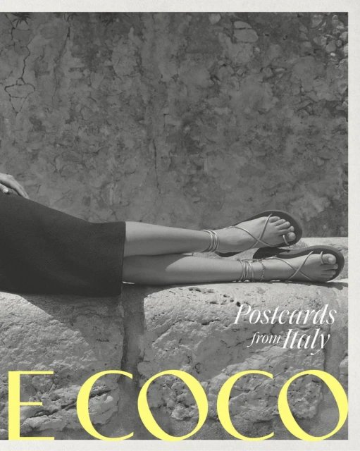 Closeup of a woman's legs resting on a stone structure, showcasing strappy sandals with a natural, textured stone backdrop and bright yellow text.