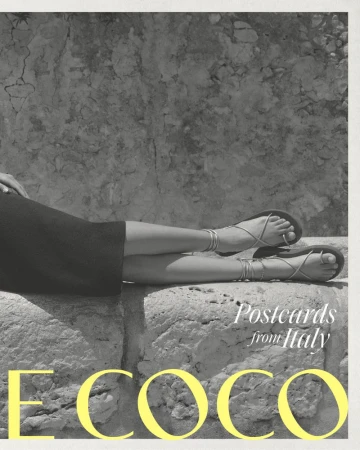 Closeup of a woman's legs resting on a stone structure, showcasing strappy sandals with a natural, textured stone backdrop and bright yellow text.