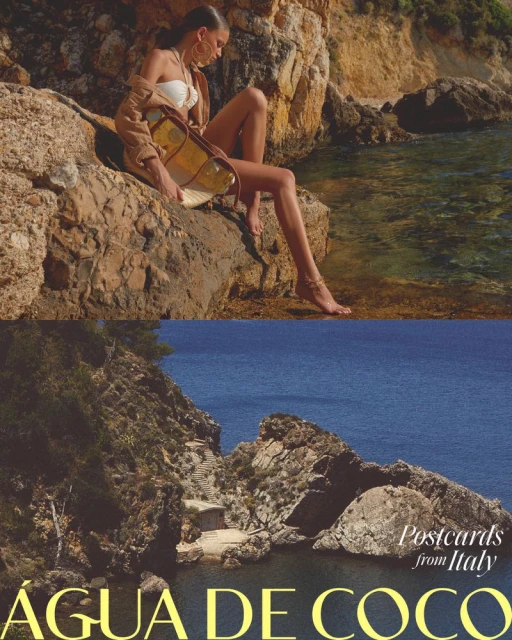 Adult woman in swimwear with a beach bag sitting on coastal rocks near the ocean on a sunny day, lower half shows an Italian coastline.