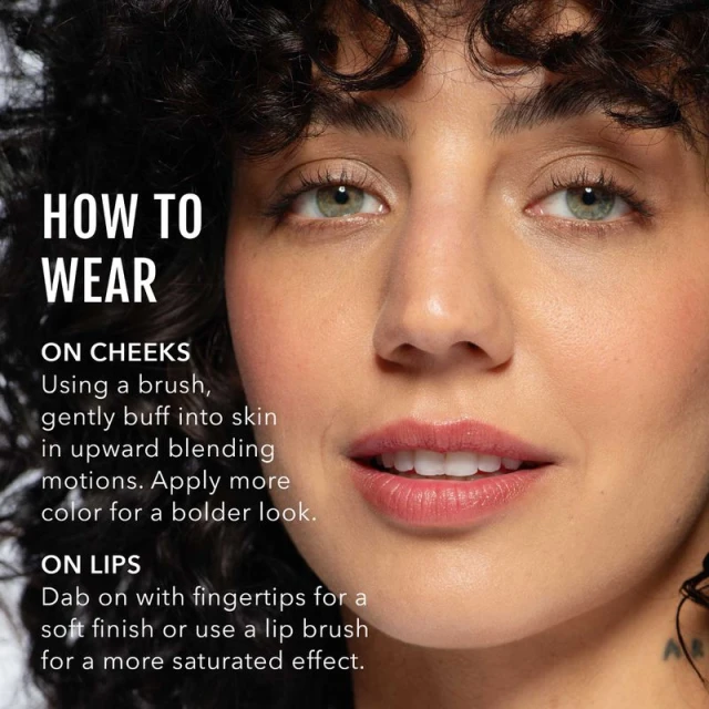 Close-up portrait of a woman with curly hair and makeup, with text overlay describing how to wear makeup on cheeks and lips.