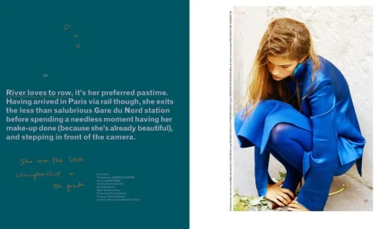 Model in vibrant blue satin suit crouching against an off-white wall for MARFA editorial project
