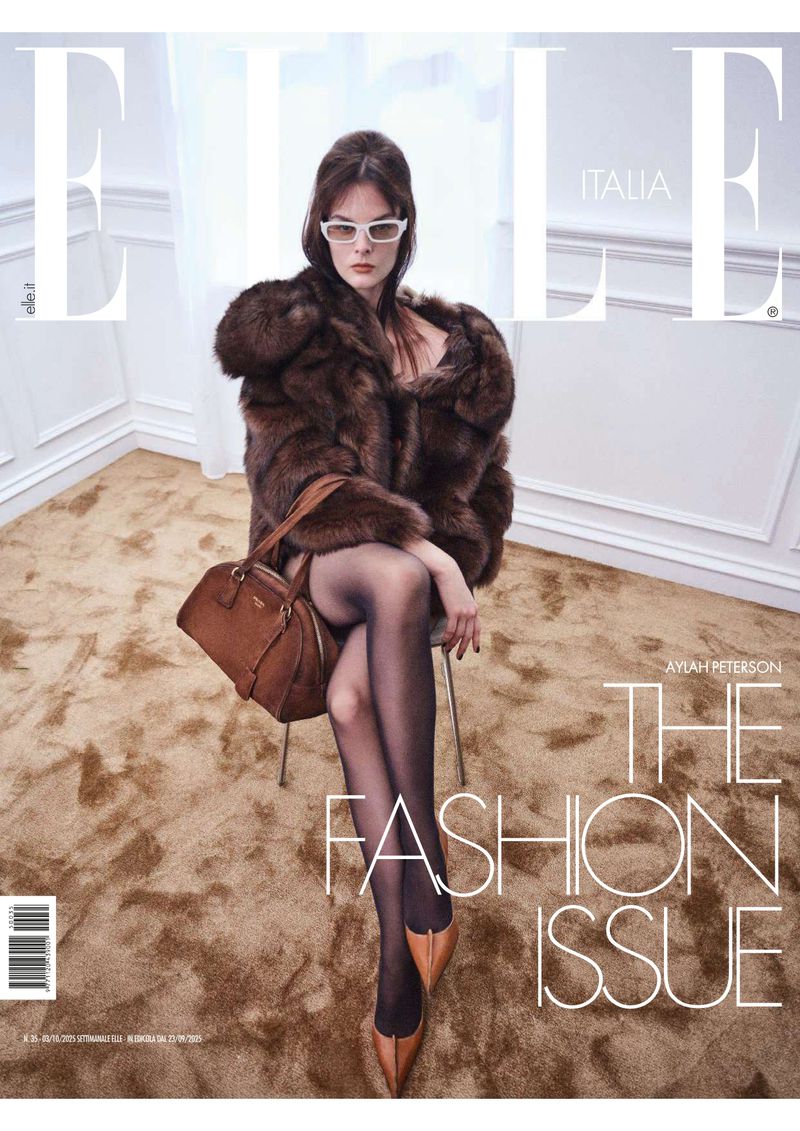 Elle Italia magazine cover featuring a woman in a brown fur coat and sunglasses, seated with a leather bag, and text overlay.