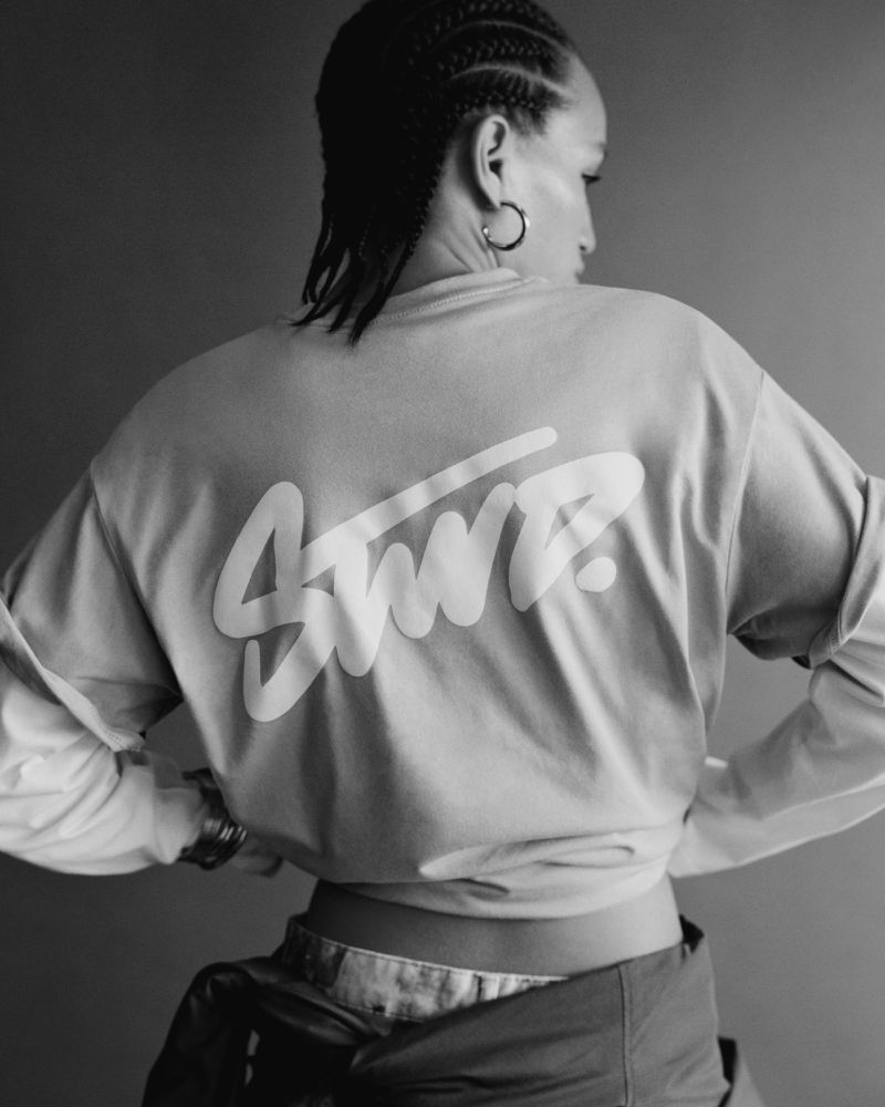 Model wearing printed long-sleeve top with STWD lettering on back for Pull & Bear campaign, photographed by Louie Cobo.