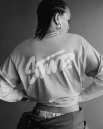 Model wearing printed long-sleeve top with STWD lettering on back for Pull & Bear campaign, photographed by Louie Cobo.