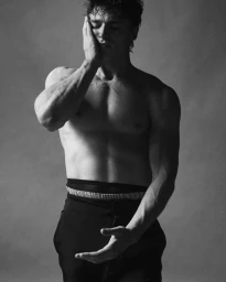Portrait of Nicholas Alexander Chavez shirtless wearing black trousers for Jacquemus x Nike Moon Shoe 2025 campaign.
