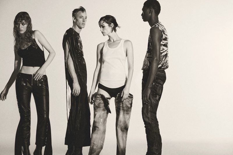 Four models posing in leather trousers, a white tank top, and distressed denim against a plain white studio background.