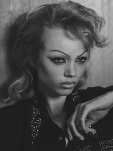 Monochrome portrait of a model with dramatic winged eyeliner and nose ring for Harper's Bazaar France by David Sims