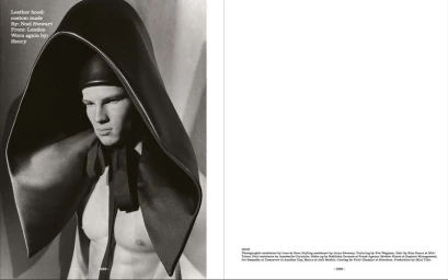 Black and white editorial magazine spread featuring male model Henry wearing a large sculptural leather hood tied with ribbon.