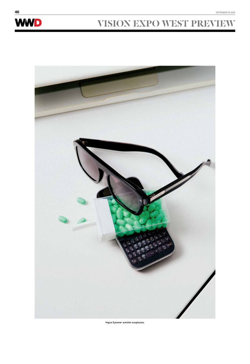 Sunglasses rest on top of a vintage phone filled with green candy, all set against a clean white background, evoking a sense of retro-cool.