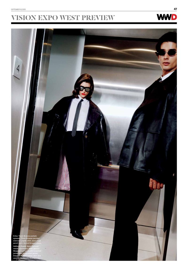 Editorial fashion shot of a stylish couple in black coats and sunglasses inside of an elevator. Classic retro fashion aesthetic.