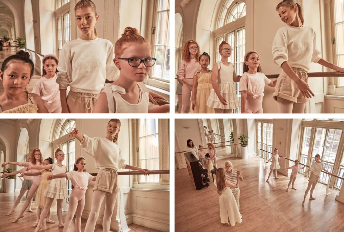 Dance class featuring ballet students and an instructor at a barre in a studio, with natural light illuminating the scene and a piano nearby.