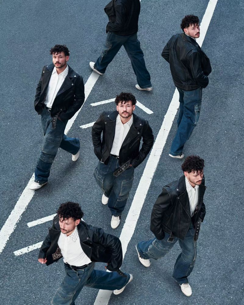 Multiple images of a man wearing a black leather jacket, white shirt, and jeans walking in different directions on an asphalt road.