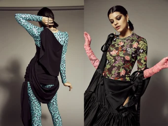 Two side-by-side views of a female model wearing patterned long-sleeve tops, black draping, and pink lace gloves against a grey background.