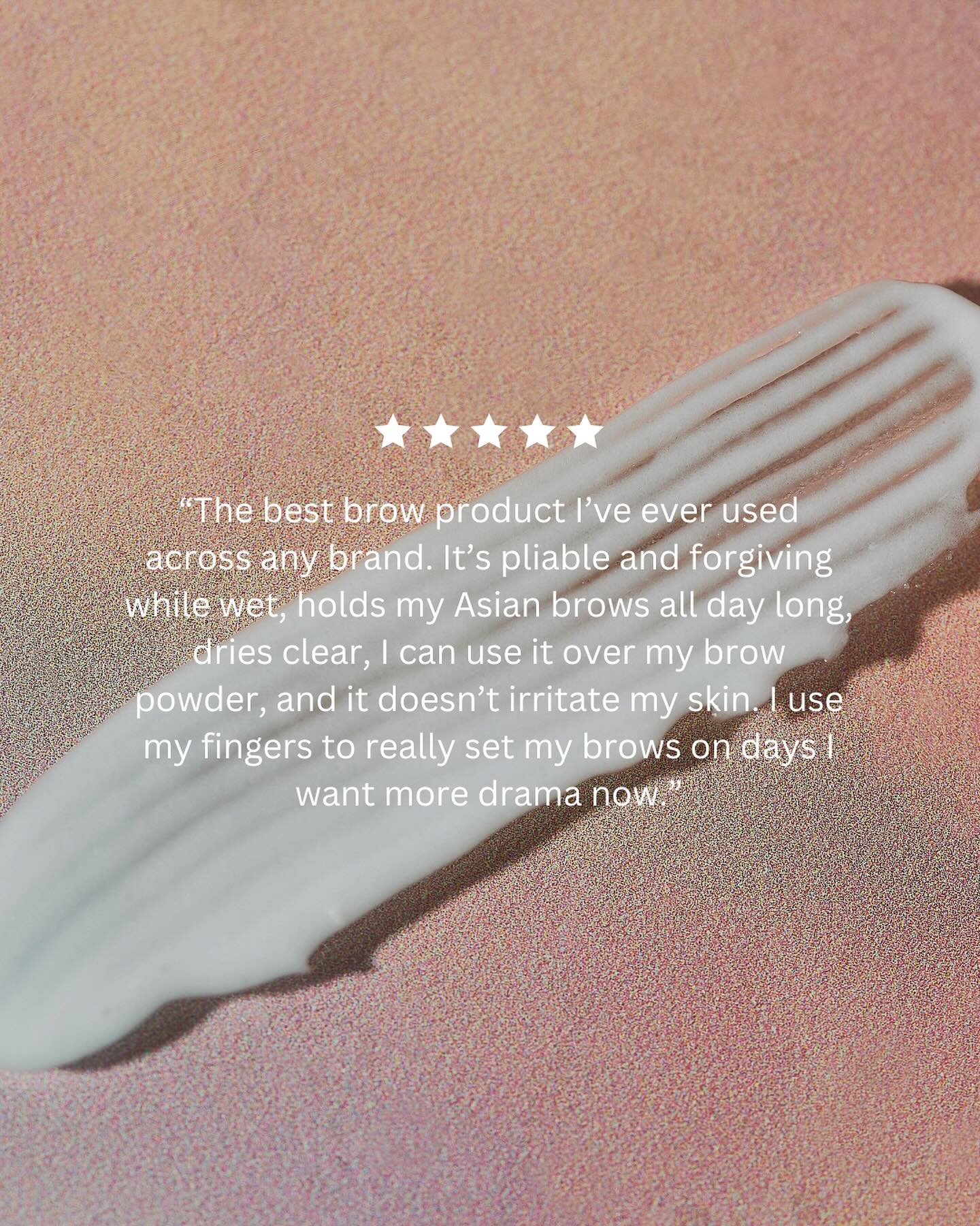 Close-up of a swatch of white cosmetic product, likely for eyebrow grooming, set against a light peach background. Stars included.