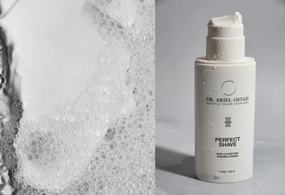 White bottle of Dr. Ariel Ostad shaving cream with water droplets next to a close-up of textured soapy foam lather.