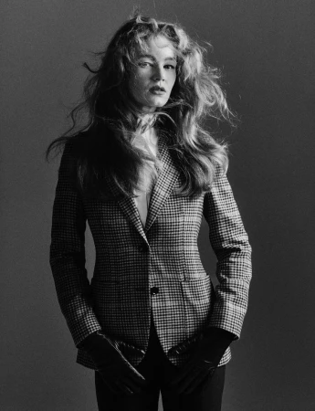 Hollie May Saker in a houndstooth tailored blazer and black gloves for Vogue Greece Brit Style Revisited editorial.