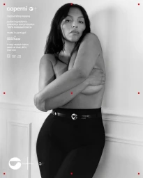 Model Paloma Elsesser wearing black leggings in a black and white fashion portrait for Coperni C+
