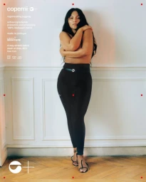 Model Paloma Elsesser wearing black leggings against a white wall for Coperni C+ campaign.