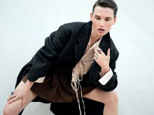 Model Giedre Dukauskaite wearing a dark herringbone blazer and rings in a Harper's Bazaar Espana fashion editorial by Javier Biosca.
