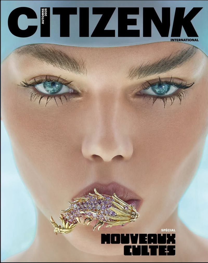 Citizen K International magazine cover featuring a woman with blue eyes, wearing a swimming cap and a gold fish brooch in her mouth.