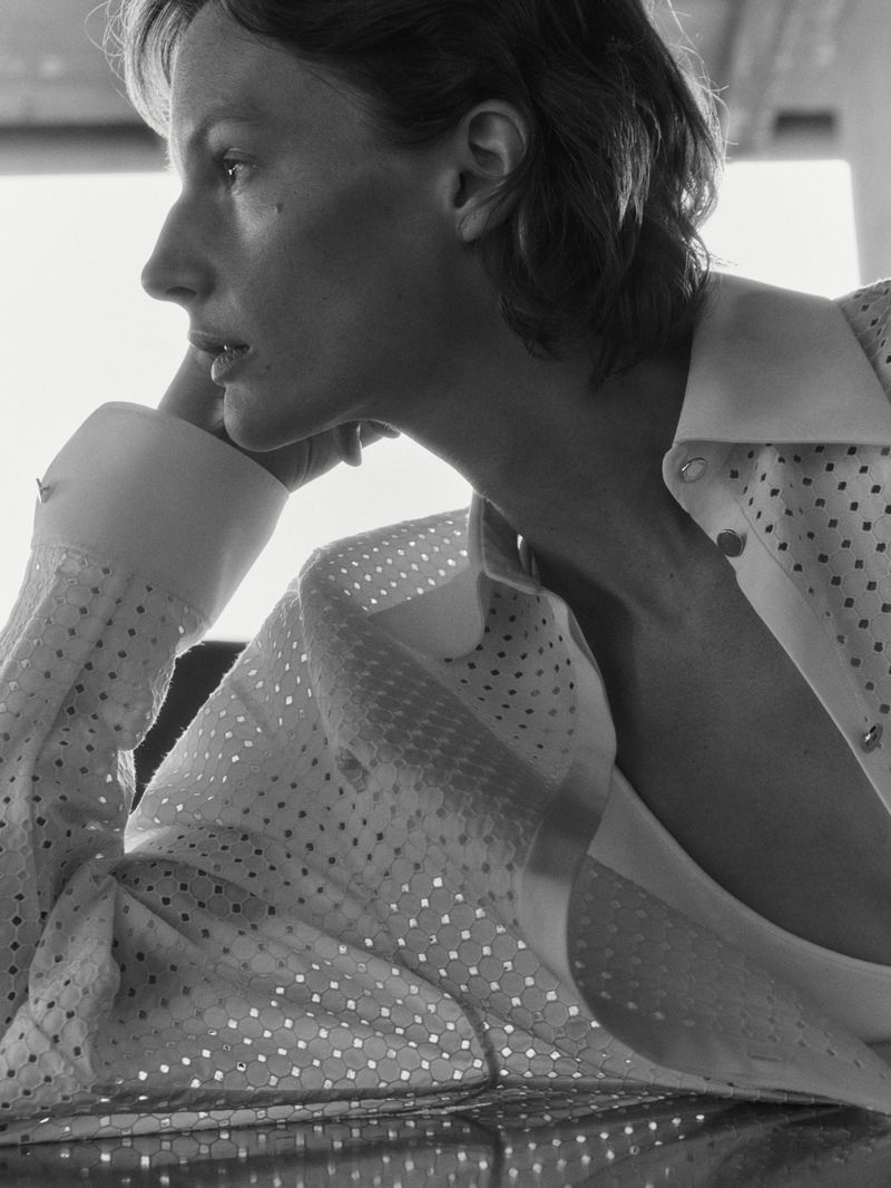 Close-up profile of model Sara Blomqvist wearing a white perforated shirt for Giada 2025 SS Leisure campaign