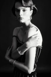 Model Aylah Peterson wearing striped top and silver hoop earrings in black and white portrait for Rush by Charles Dennington.