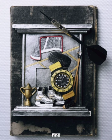 Still life with hockey equipment, ice skates, a trophy, a watch and a dart on a book. Close-up studio shot with detailed textures.